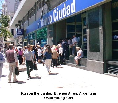 Cues outside banks to try and get savings. There are no links to or from this image. &copy;2001 - Ken Young